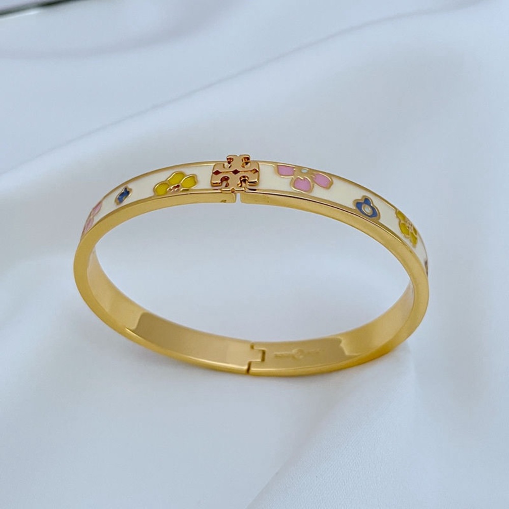 Tory Burch Gold and White Floral Bracelet
